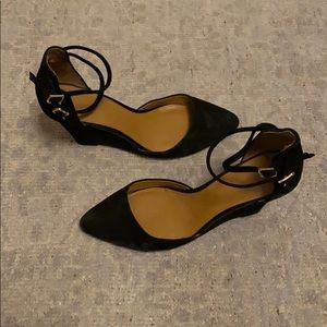 Black suede pumps with ankle strap